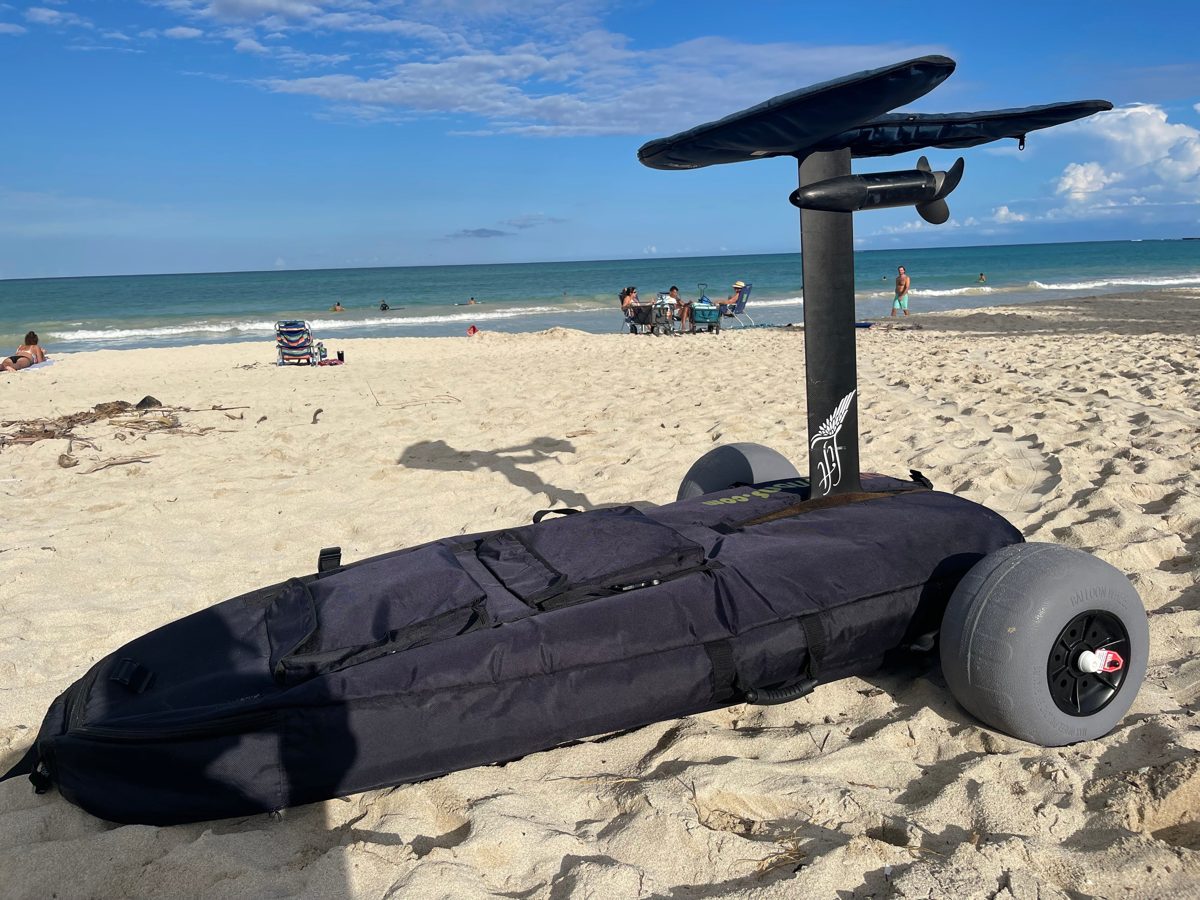 EfoilSolutions V2 eFoil Cart & Bag on the beach with balloon wheels